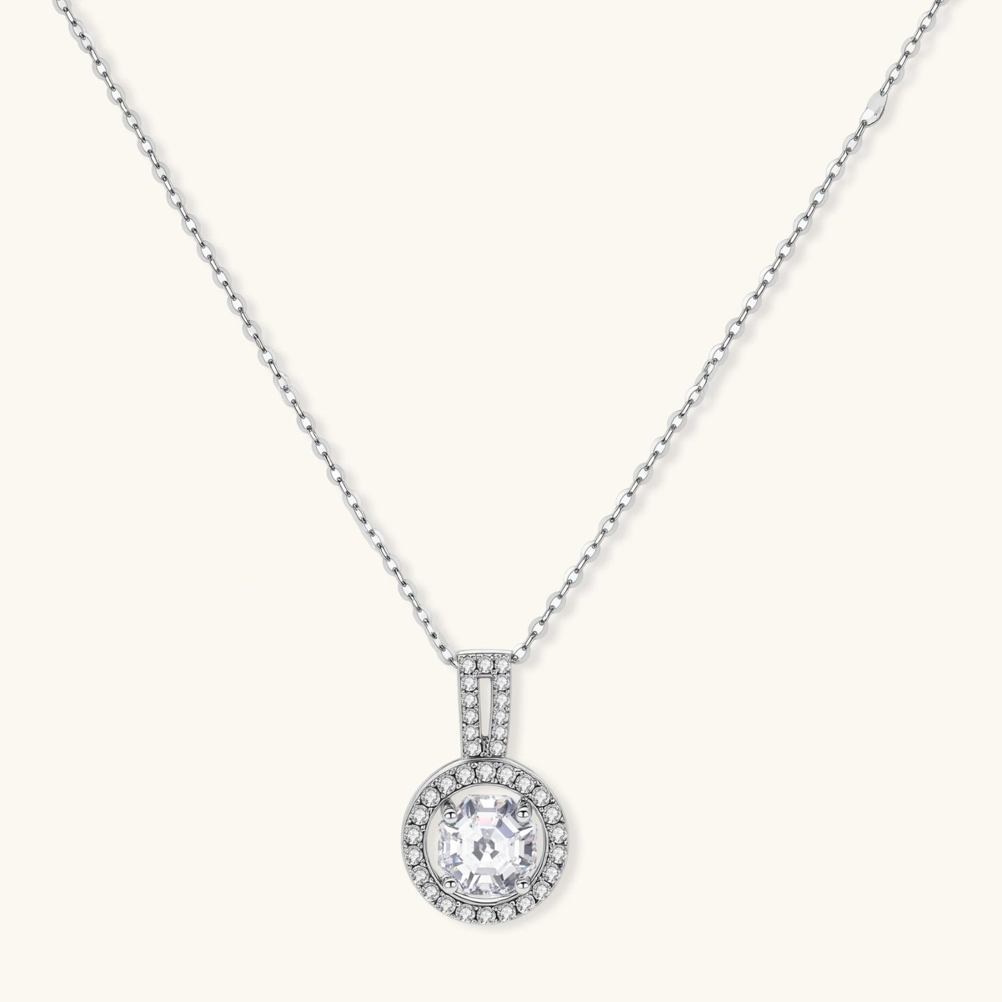 Platinum-plated sterling silver necklace with round halo pendant featuring central crystal surrounded by smaller stones