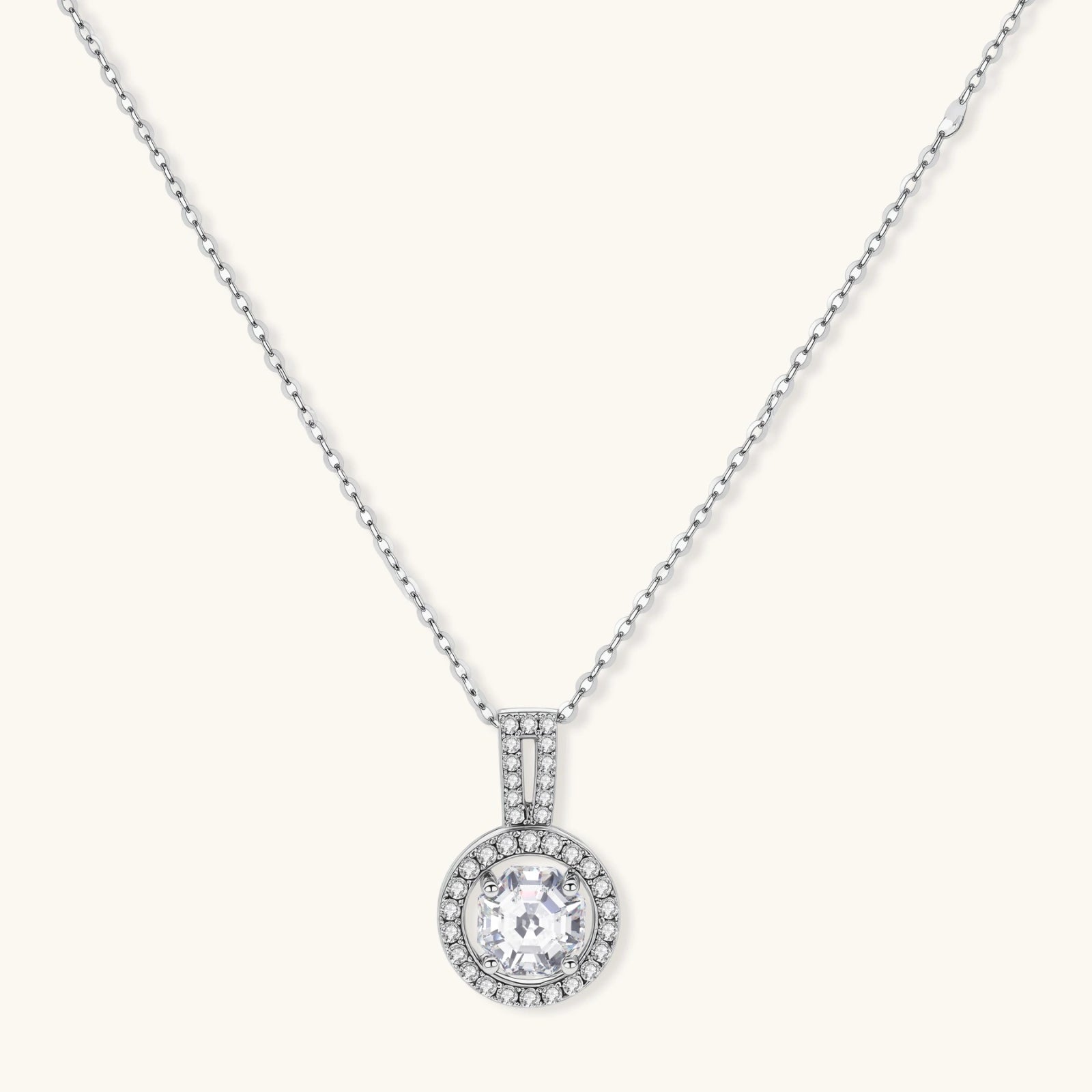 Platinum-plated sterling silver necklace with round halo pendant featuring central crystal surrounded by smaller stones